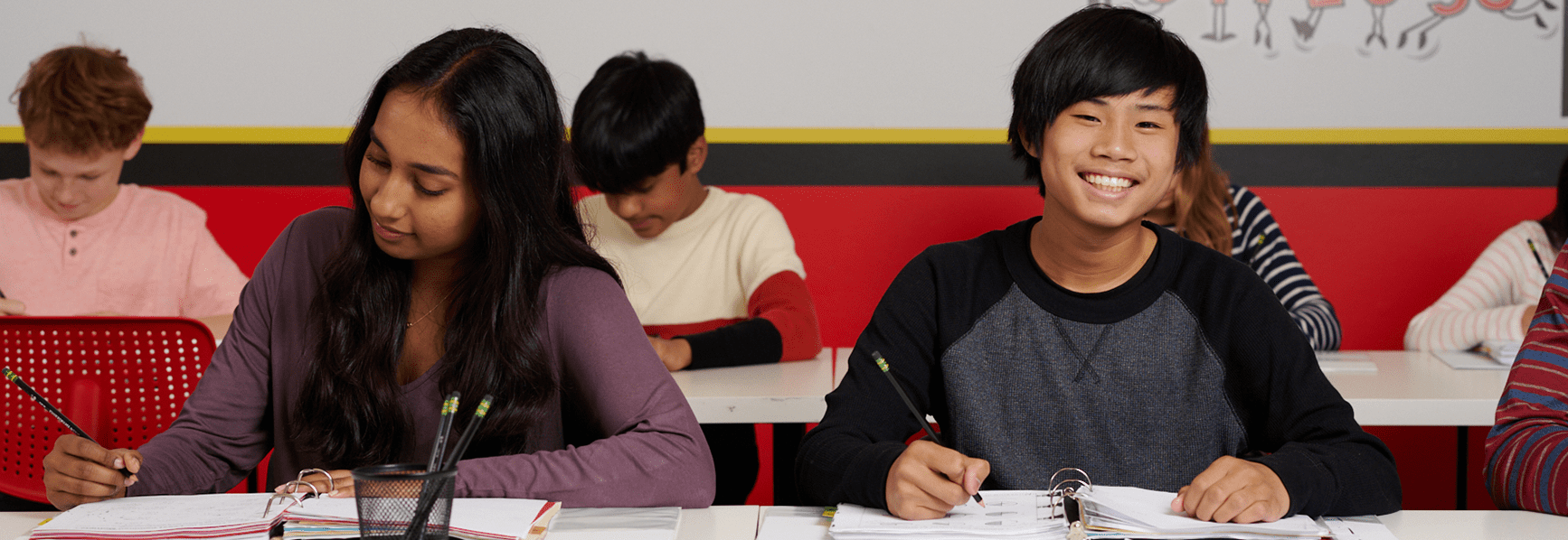 Students working on math assignments in classroom