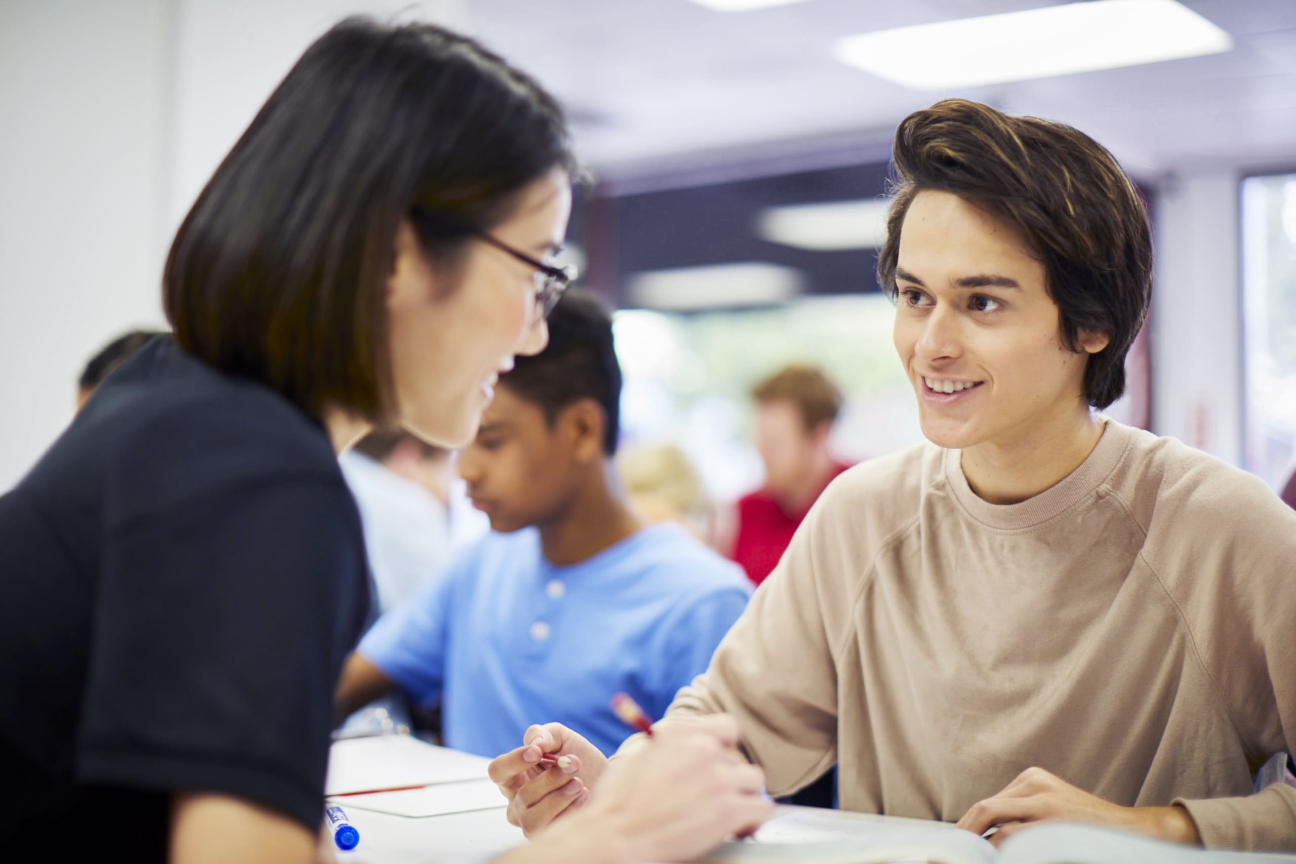 One-on-one math tutoring session helping a student solve equations