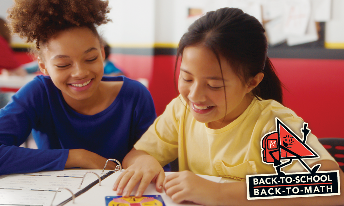 Girls smiling while working on math problems