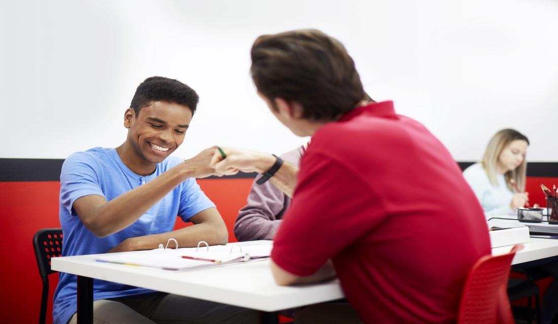 Mathnasium math tutor and student solving math problems.