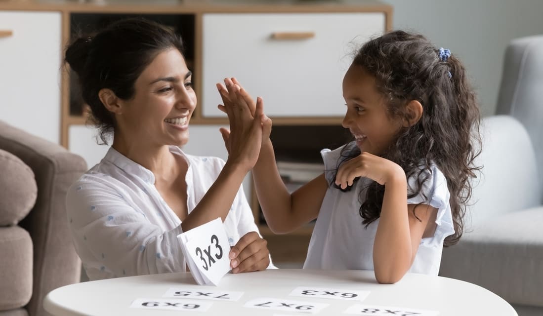 Mother and daughter playing a mutliplication game